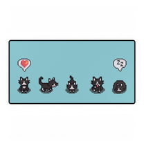 A rectangular desk mat features a black and white pixel art pattern of tuxedo cats from Stardew Valley in various poses.