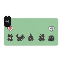 A light green gaming desk mat featuring pixelated tuxedo cats in a Stardew Valley style, accompanied by an LED wireless charger.