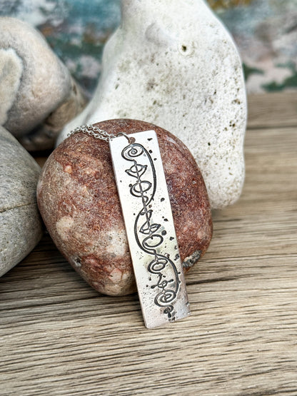 Star Trek IDIC sterling silver necklace with a vulcan calligraphy etched design