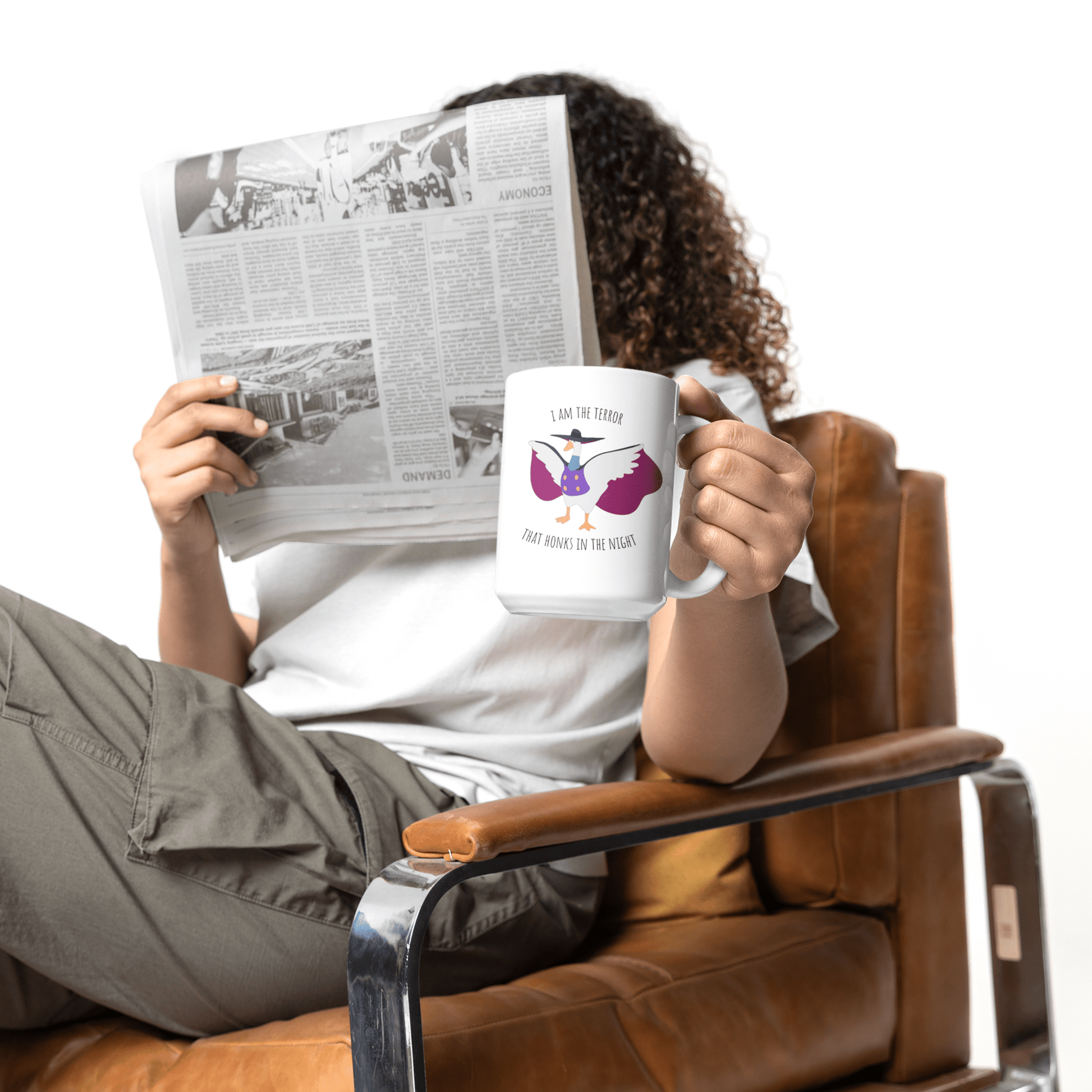 Darkwing duck / Untitled Goose large 15oz mug with 'I am the terror that honks in the knight' being held in the hand of a woman with curly hair and a newspaper