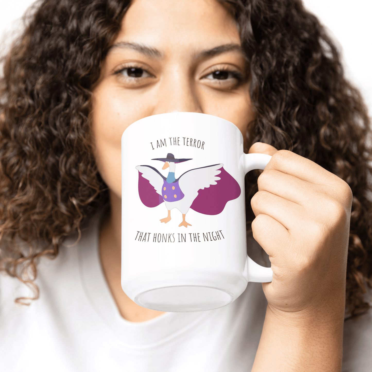 Darkwing duck / Untitled Goose large 15oz mug with 'I am the terror that honks in the knight' being held in the hand of a woman with curly hair