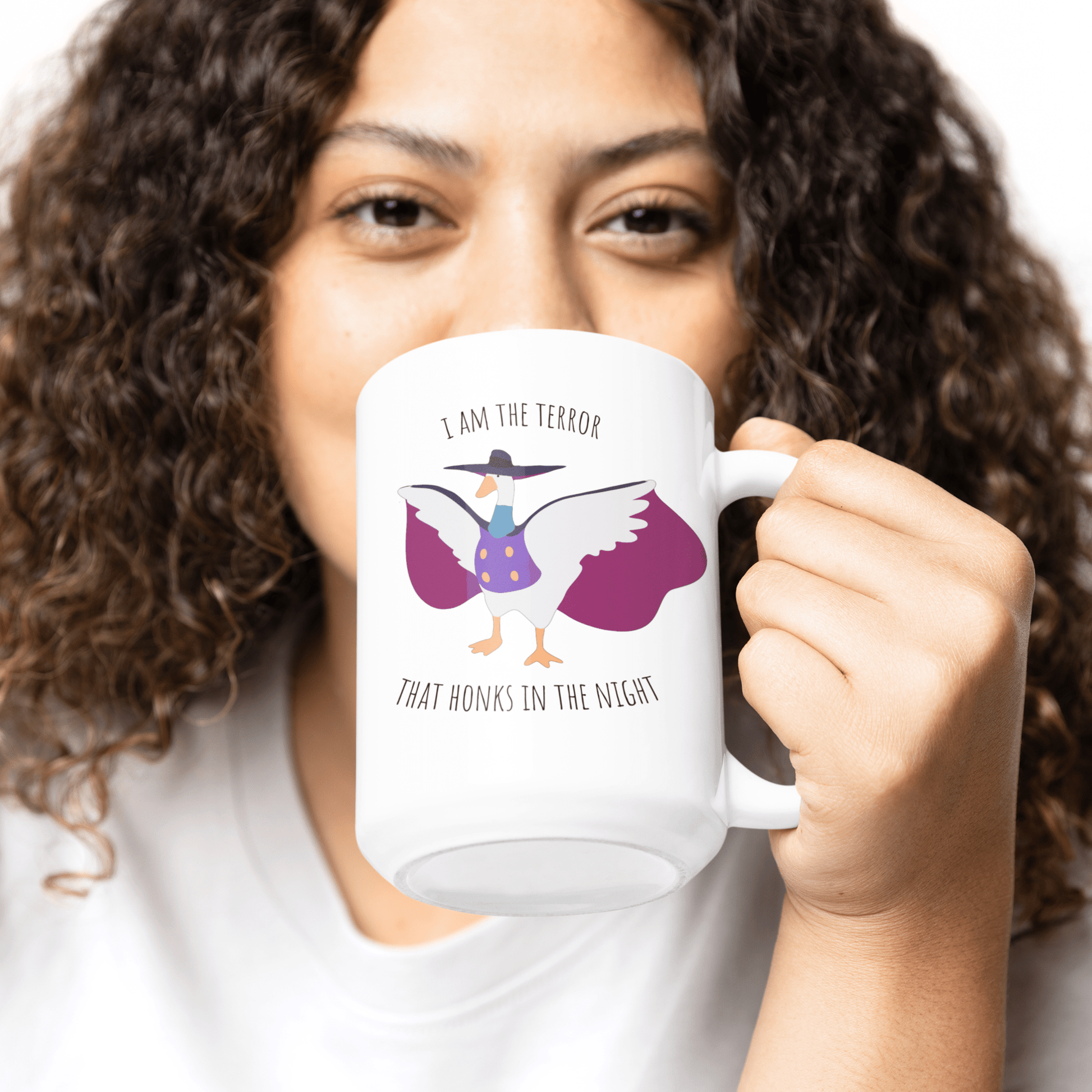 Darkwing duck / Untitled Goose large 15oz mug with 'I am the terror that honks in the knight' being held in the hand of a woman with curly hair