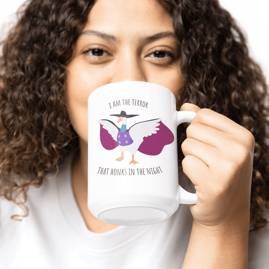 Darkwing duck / Untitled Goose large 15oz mug with 'I am the terror that honks in the knight' being held in the hand of a woman with curly hair
