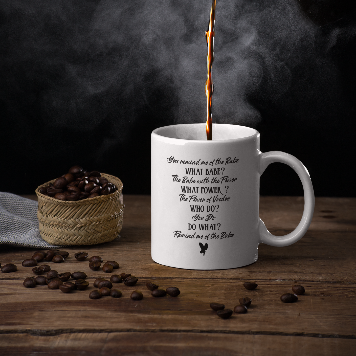 Steaming coffee being poured into a Labyrinth movie mug with Dance Magic lyrics, surrounded by coffee beans on a wooden surface.