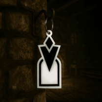 A 3D acrylic keyring featuring a black and white Skyrim inspired quest marker icon hanging from a metal ring on a stone wall.
