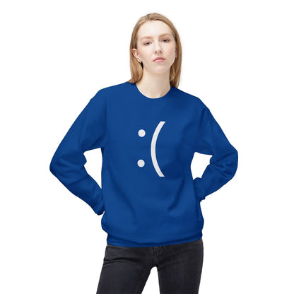 A person wearing a blue sweatshirt featuring a white "Blue Screen of Death" style sad face emoticon.