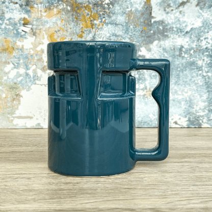 A teal ceramic mug designed to resemble a Raktajino dispenser from Star Trek: Deep Space Nine.