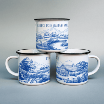 Three enamel camping cups feature a blue and white toile de Jouy pattern depicting scenes from Stardew Valley, including a landscape and a cottage.