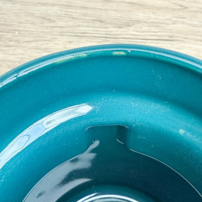 A handmade "Rejected Raktajino Mug" by Quirkify, sitting on a wooden surface. Give one a good home today!.