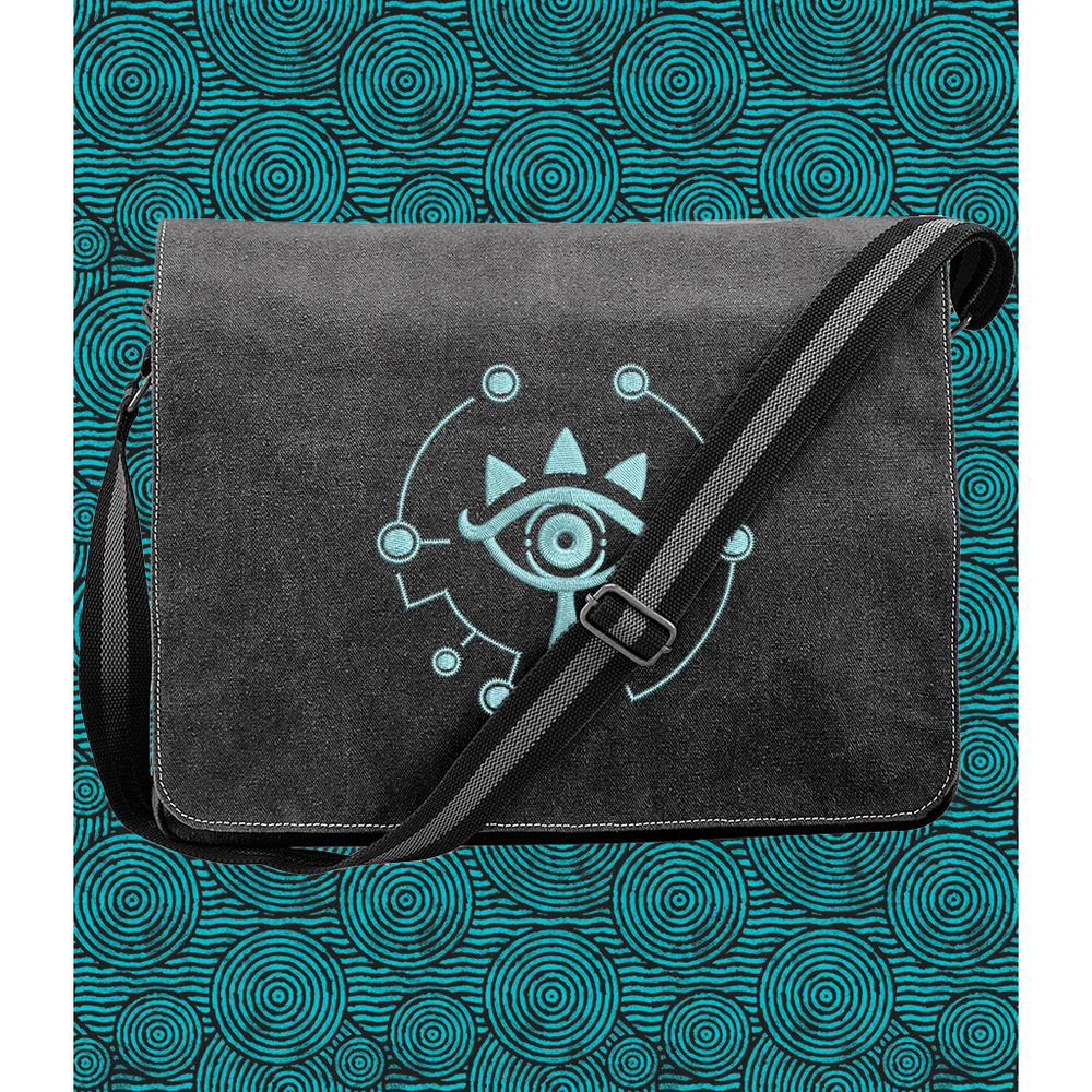 Black canvas bag with a blue Sheikah embroidered emblem from Legend of Zelda
