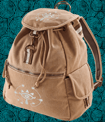 A brown Zelda Sheikah backpack features glow-in-the-dark embroidery of a stylized eye symbol on the front pocket and flap.