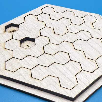 A wooden hexomino puzzle inspired by Star Trek features cutouts labeled "Jan" and "1".