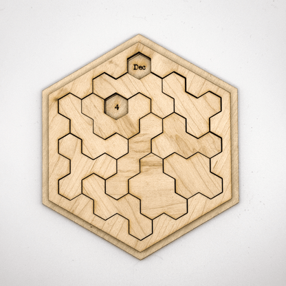 A wooden hexomino puzzle featuring the letters "Dec" and the number "4" is arranged within a hexagonal frame.