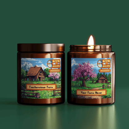Two Stardew Valley scented candles are displayed side-by-side, each featuring a pixelated landscape scene and customizable farm name label.