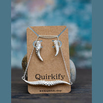 A brown Quirkify card showcases the Handmade Solid Silver Kraken Tentacle Necklace & Earring Set, inspired by Cthulhu and D&D, against two gray stones with a blurred blue and gray background.