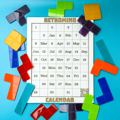 A calendar labeled "Retromind" is surrounded by colorful KronoBlox puzzle pieces arranged like Tetrominoes.