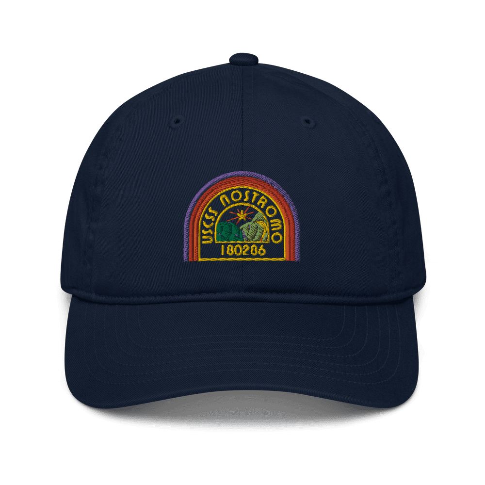 A navy blue baseball cap features an embroidered logo of the USCSS Nostromo with a rainbow style design and the number 180286.