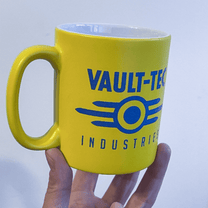 A yellow mug displays the Vault-Tec Industries logo from the Fallout video game series.