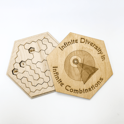 A wooden Star Trek inspired puzzle features a hexagonal game board with date markings and an accompanying hexomino piece displaying text about infinite combinations.