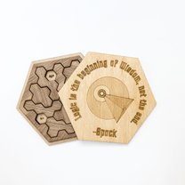 This wooden puzzle features a Vulcan symbol and quote from Spock referencing logic as part of a Star Trek inspired brain teaser game.