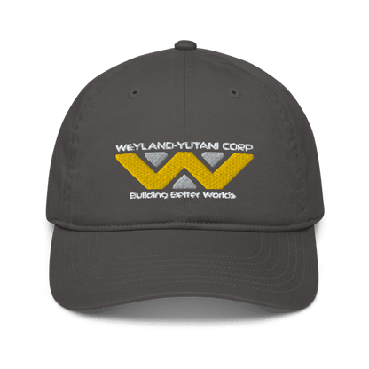 A gray baseball cap features an embroidered Weyland-Yutani Corp logo with yellow and white geometric shapes and the words "Building Better Worlds.