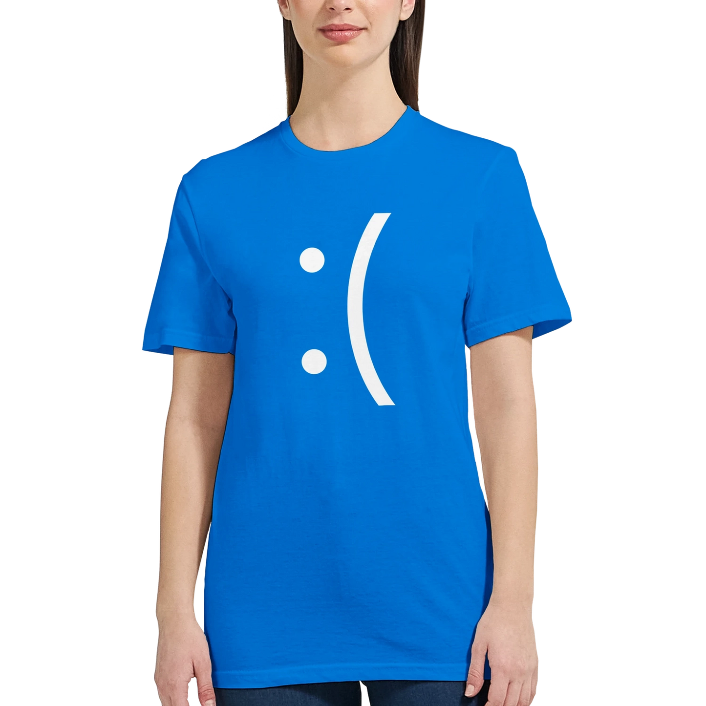 A woman wearing a blue ladies fit tee displays a white sad face icon referencing the Blue Screen of Death error from Windows.