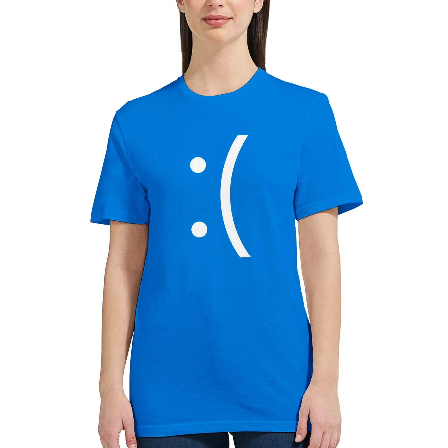 A woman wearing a blue ladies fit tee displays a white sad face icon referencing the Blue Screen of Death error from Windows.