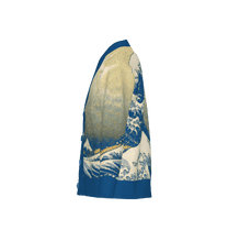 Side view of a Great Wave knit cardigan featuring blue and white Japanese art inspired wave patterns on a cream background.
