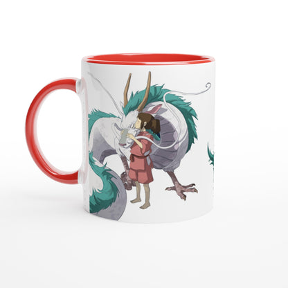 A white mug depicts Chihiro hugging Haku, a dragon from Studio Ghibli's Spirited Away.
