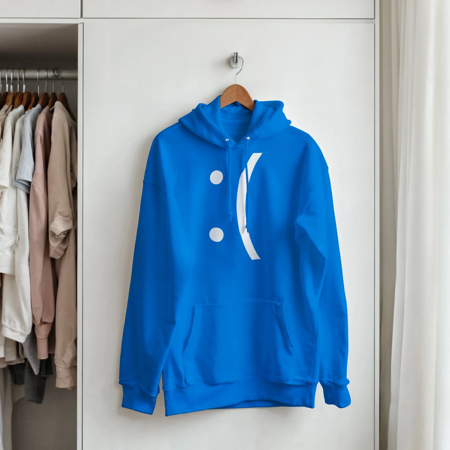 A blue hoodie displays a white graphic resembling the "Blue Screen of Death" error message from classic Windows computers, featuring a sad face emoticon.