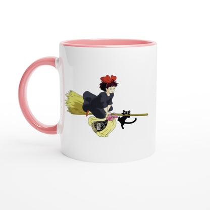 A white mug depicts Kiki from Kiki's Delivery Service riding a flying broomstick with her cat Gigi, inspired by Studio Ghibli.