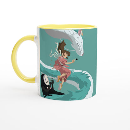 A yellow mug displays a graphic illustration featuring characters Haku, Chihiro, and No-Face from Studio Ghibli's Spirited Away.