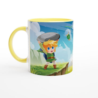 A yellow mug depicts a chibi Link from The Legend of Zelda lifting a large rock while a Korok flies nearby.
