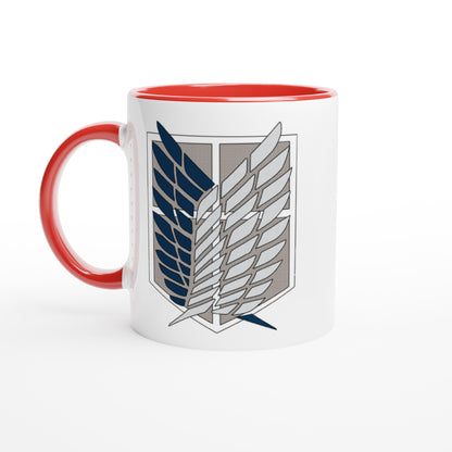 A white ceramic mug with a red handle and interior features the Wings of Freedom emblem from Attack on Titan.