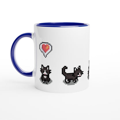 A white mug with a blue handle and rim features pixelated graphics of tuxedo cats and a heart, referencing the Stardew Valley computer game.