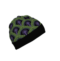 A knitted beanie hat featuring a green and purple Room 237 wallpaper pattern inspired by The Shining.