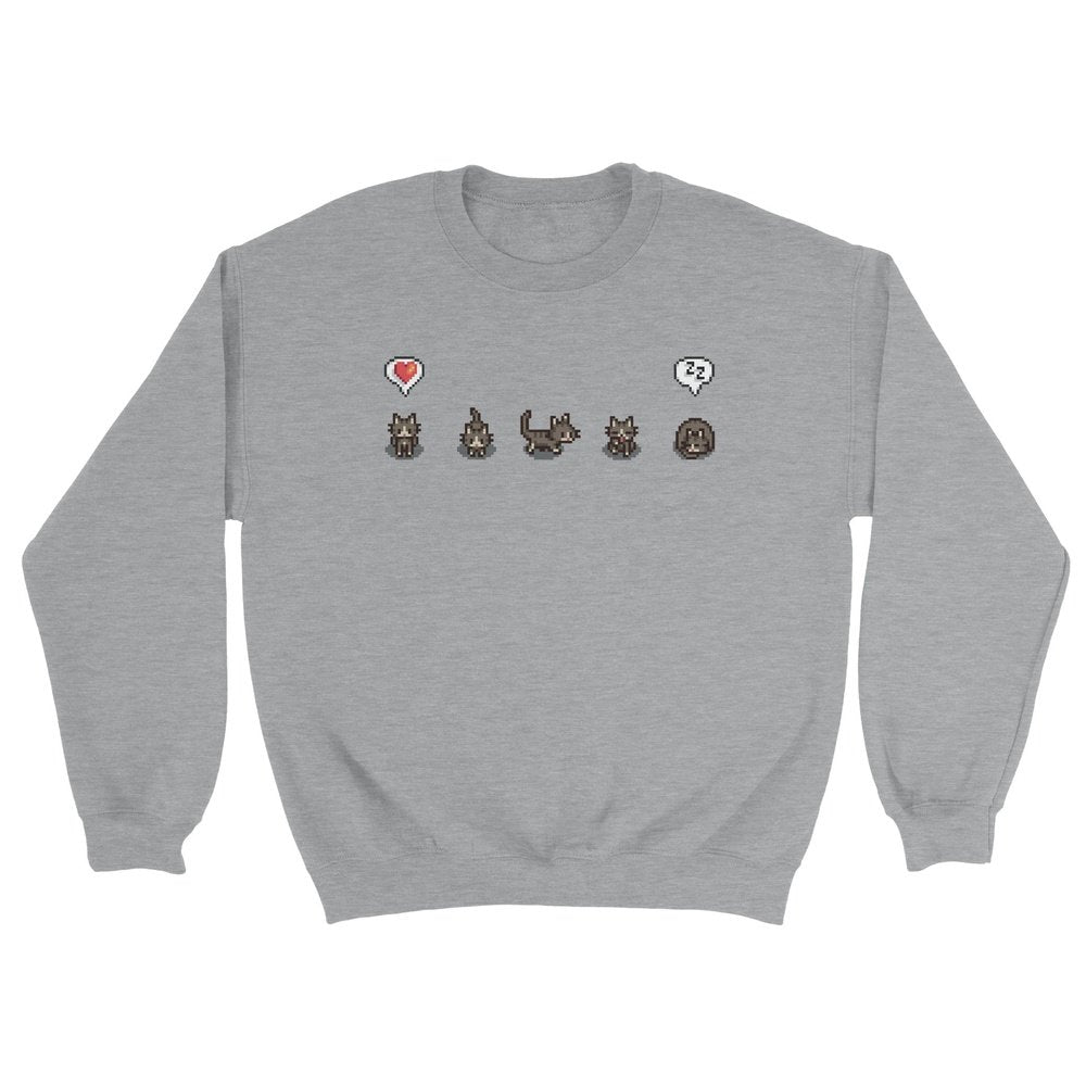 A grey unisex crewneck sweatshirt features a row of pixelated cat characters and emotes from Stardew Valley.