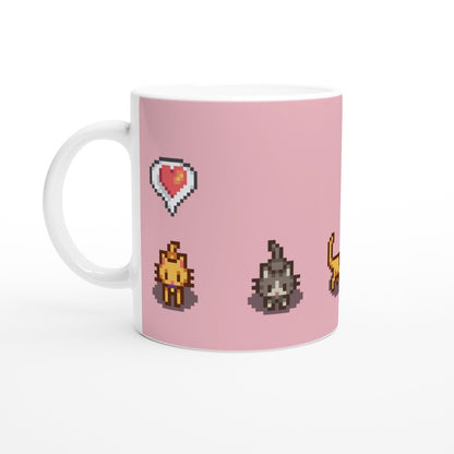 A white mug displays pixel art of ginger and tabby cats alongside emotes from the Stardew Valley computer game on a pink background.
