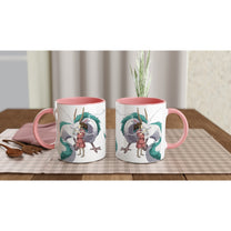 Two white mugs with pink handles depict Haku as a dragon and Chihiro from Spirited Away, inspired by Studio Ghibli.