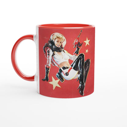 A white mug features a vintage distressed poster design depicting a woman in a spacesuit holding a Nuka Cola bottle against a red background with stars, and has a red handle.