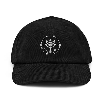 A black Zelda Sheikah embroidered dad hat features a glowing design inspired by Tears of the Kingdom.
