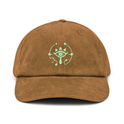 A brown corduroy dad hat features an embroidered Sheikah eye symbol from The Legend of Zelda: Tears of the Kingdom.