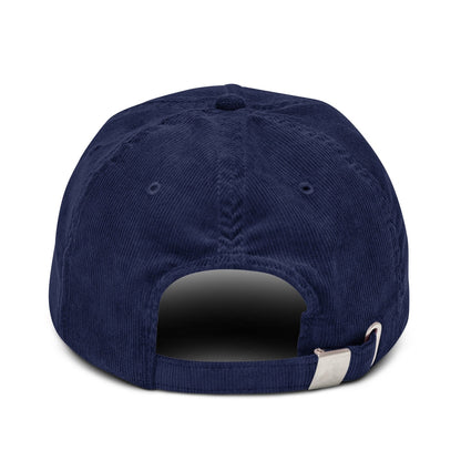 The back of a blue Vault-Tec baseball cap shows adjustable straps and stitching details.