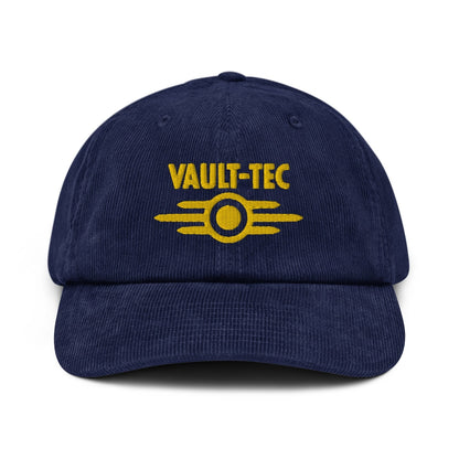 A blue Vault-Tec baseball cap features yellow embroidered lettering and a logo referencing the Fallout video game series.