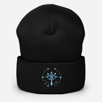 A black knitted beanie features an embroidered Sheikah eye design inspired by Tears of the Kingdom.