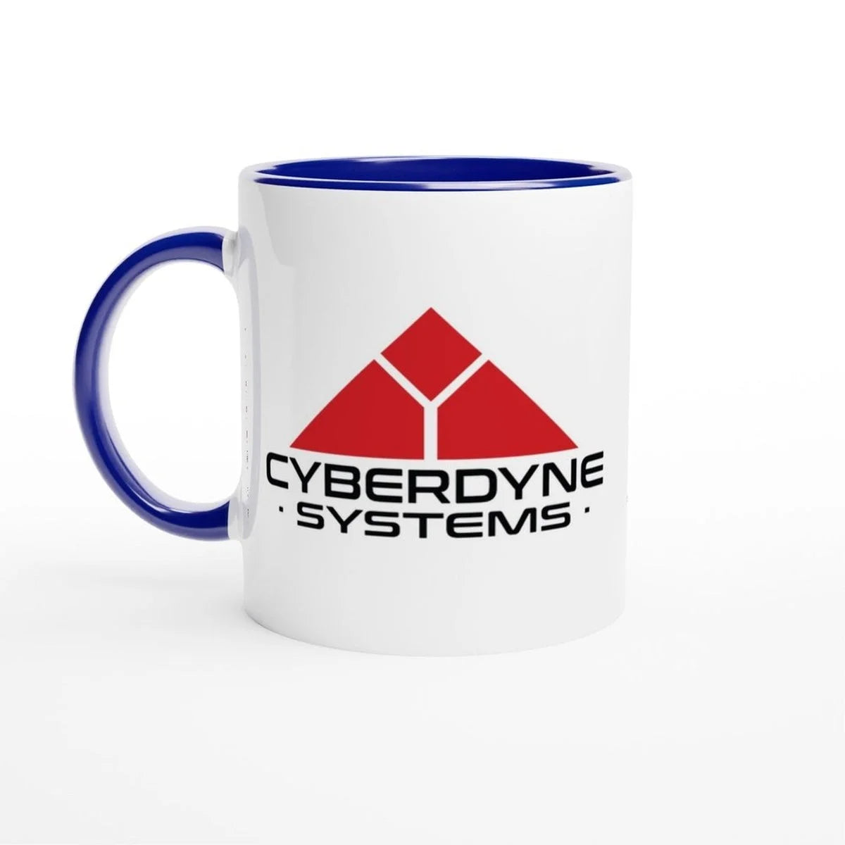 A white ceramic mug features the Cyberdyne Systems logo from the Terminator 2 movie, displaying a red geometric design and company name in black lettering.