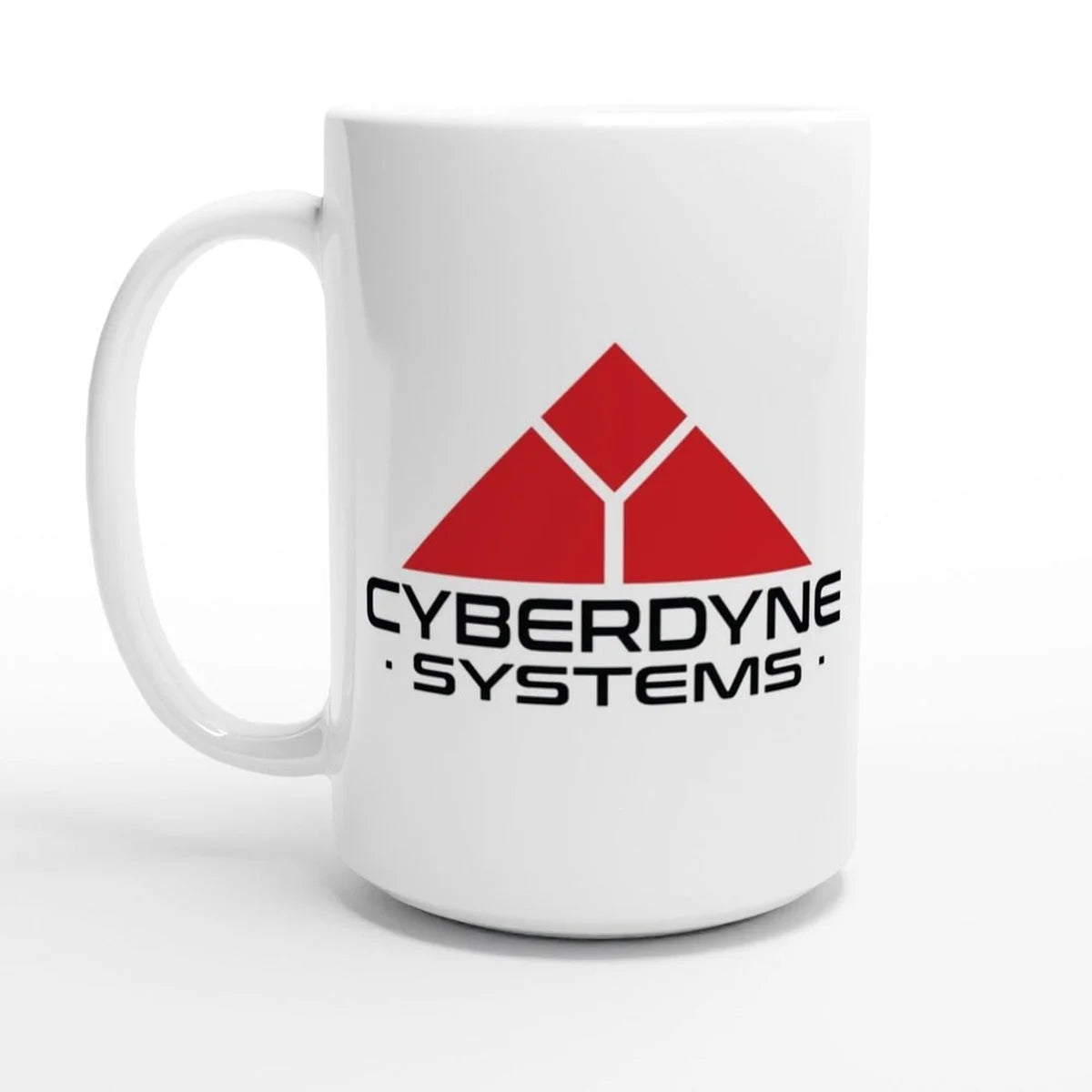 A white ceramic mug displays the red Cyberdyne Systems logo from the Terminator film series.