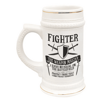 A white ceramic tankard featuring "Fighter" and related D&D imagery is decorated with gold accents and a textured handle.