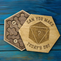 Two wooden hexagonal pieces from a DnD Edition Daily Calendar Puzzle display dates and feature a D8 die design with the phrase "Can you make today's D8?".