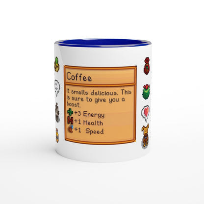 A white mug with a blue rim features a Stardew Drinks pattern depicting a coffee beverage card with pixelated sprites and stats for energy, health, and speed.